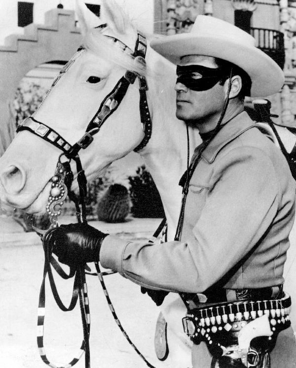 Publicity photo of Clayton Moore as the Lone Ranger and Silver