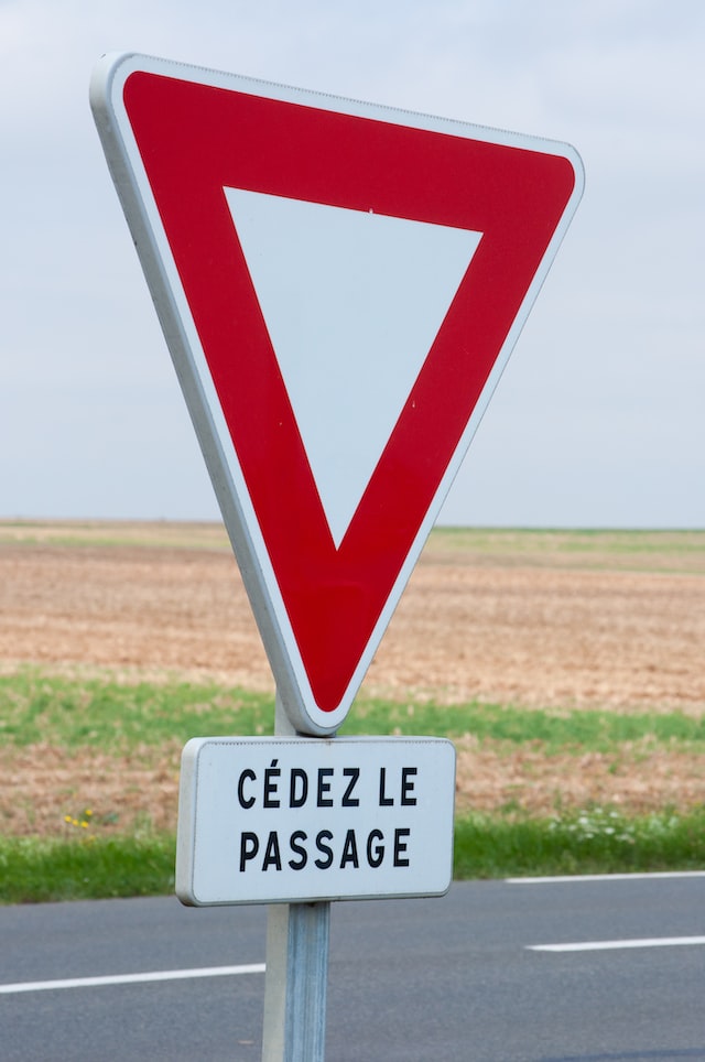 A French road sign. Photo by <a href="https://unsplash.com/@hesmundt?utm_source=unsplash&utm_medium=referral&utm_content=creditCopyText">Hes Mundt</a>